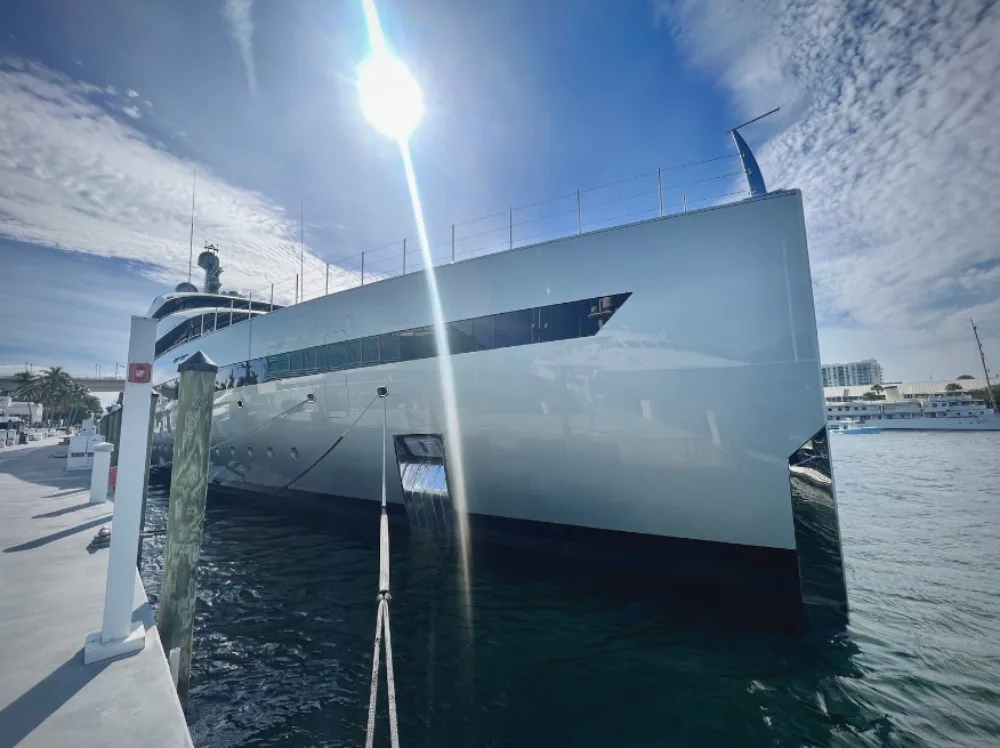 a yacht seen from a dock in Miami that has just been cleaned by cavitation cleaning