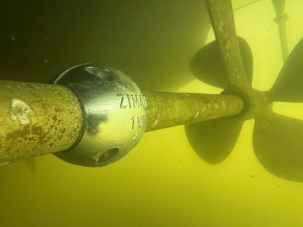 an underwater view of a newly replaced zinc anode on a vessel in Fort Lauderdale, FL